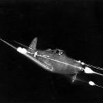Bell_P-39_Airacobra_in_flight_firing_all_weapons_at_night.jpg