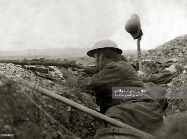 British soldier takes aim as a colleague tries to draw fire from a Bulgarian position at Salonika