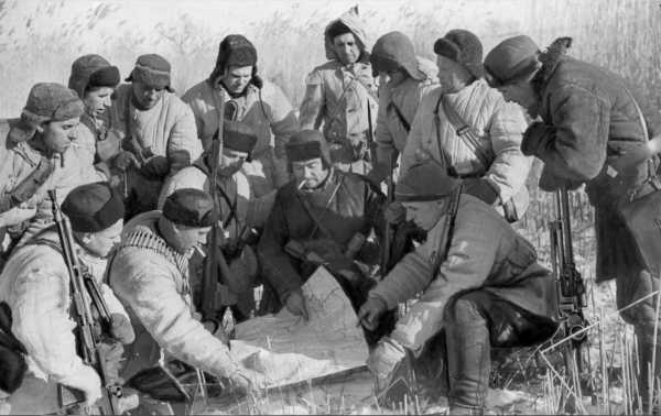 Soviet partisans planning a raid on German troops, January 1942b.